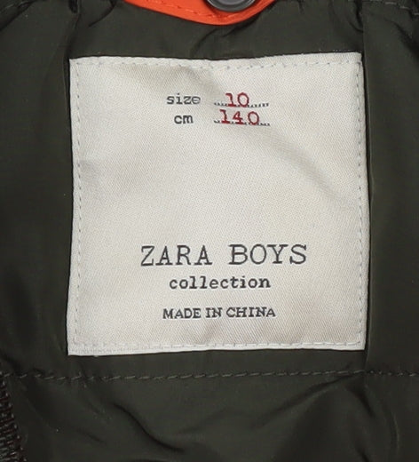 Brand and care label for Zara boys’ orange bomber jacket, hooded, size 10