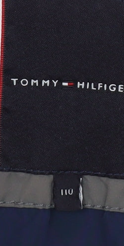 Brand and care label for Tommy Hilfiger boys’ grey hooded puffer jacket, size 110