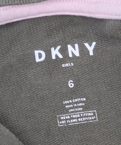 Close-up detail of DKNY girls’ green long sleeve t-shirt -, size 10, years