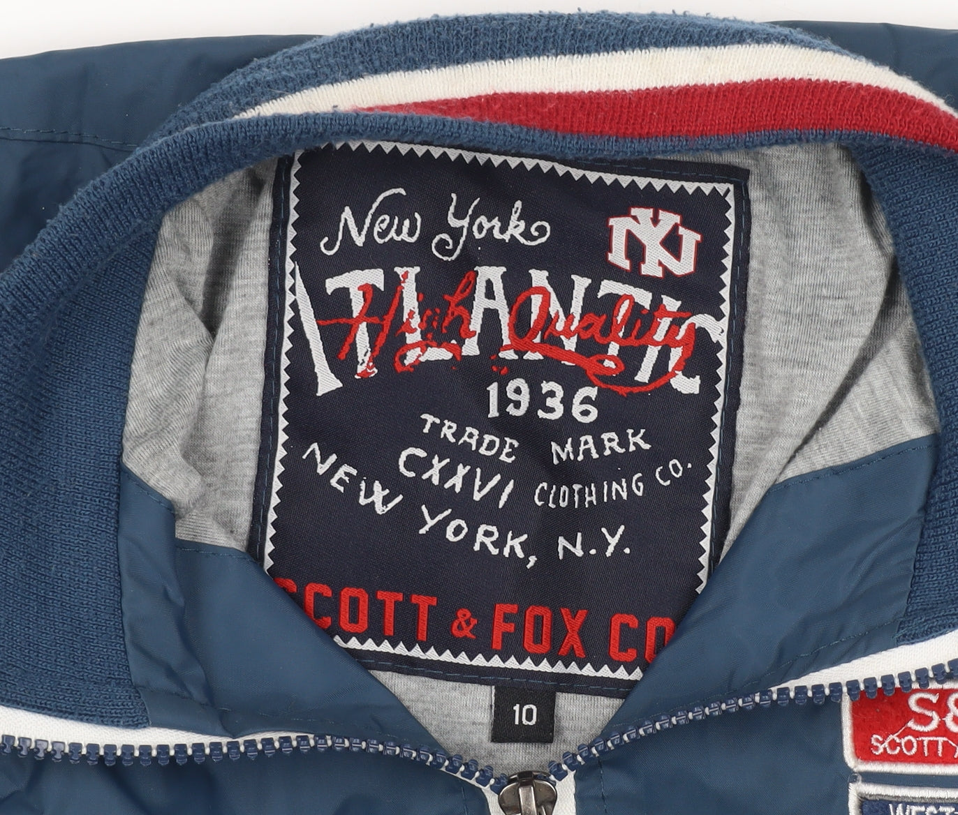 Brand and care label for Scott & Fox boys’ blue track jacket, size 10, years