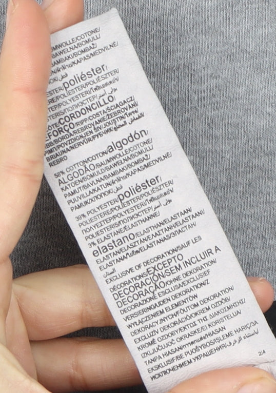 Brand and care label for Under Armour boys’ grey jogger sweatpants 6-7 years