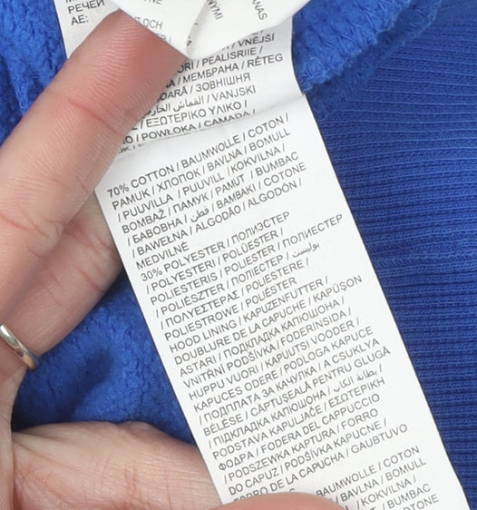 Brand and care label for Puma boys’ blue hoodie pullover, size 14, graphic design