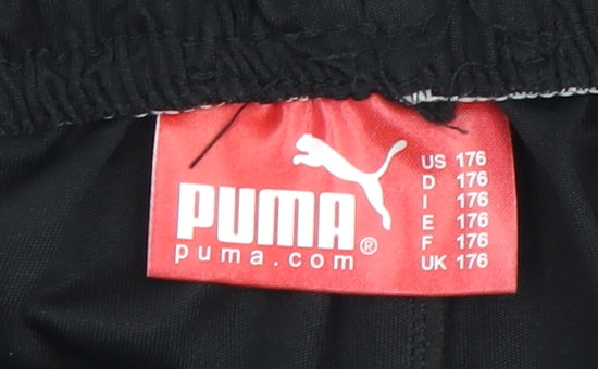 Close-up detail of Puma boys’ black athletic shorts 176 black
