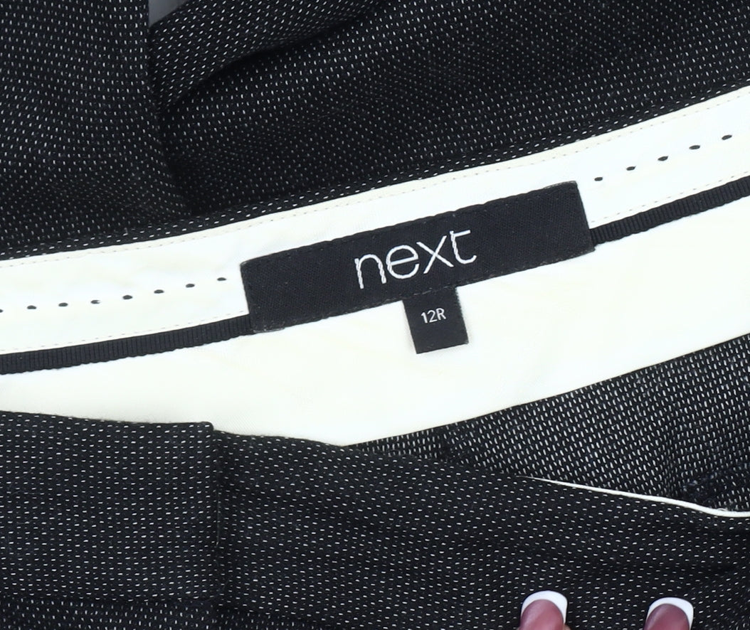 Close-up detail of Next women’s black regular fit trousers, size UK 12