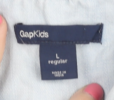 Brand and care label for Gap girls’ blue button-up sleeveless shirt, size L