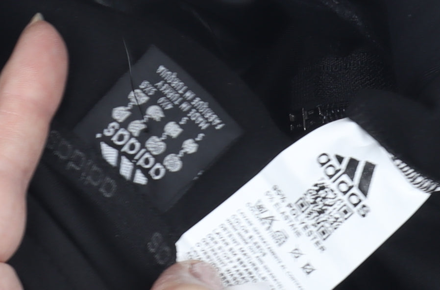 Close-up detail of adidas boys’ black track jacket, s, lightweight sportswear