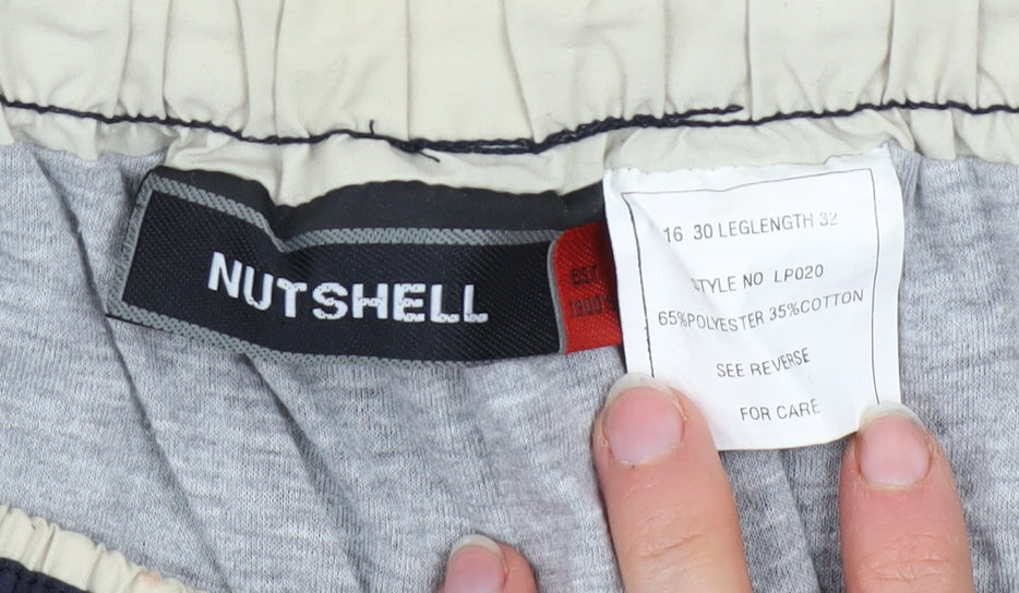Brand and care label for Nutshell Men’s Blue Cargo Trousers 30W 32L Polyester Cotton