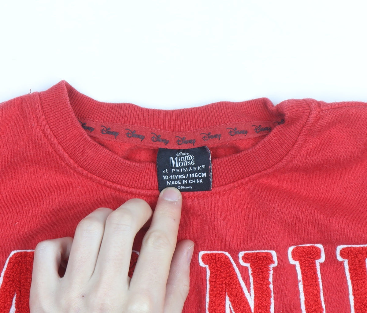 Brand and care label for Primark Disney girls’ red minnie mouse sweatshirt 10-11 years pullover