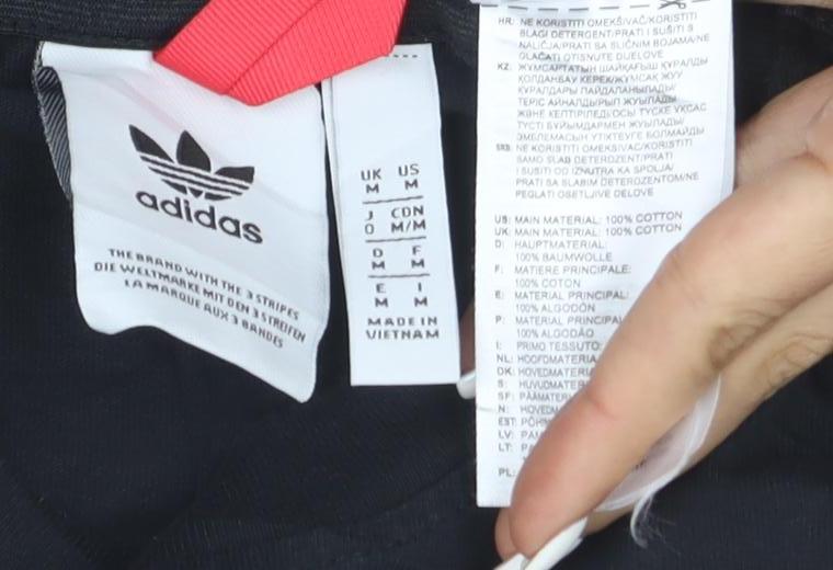 Brand and care label for Adidas Adventure Men's Black Crew Neck Short Sleeve T-Shirt M