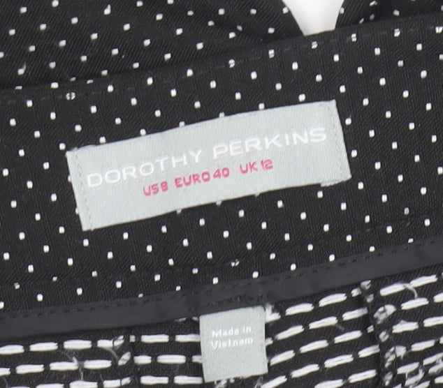 Brand and care label for Dorothy Perkins Women's Black Polka Dot Cropped Trousers UK 12
