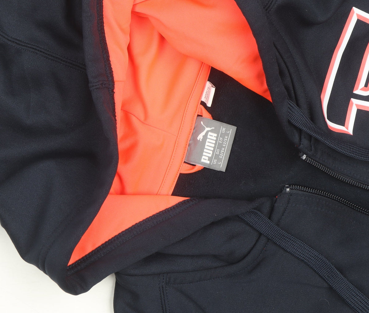 Brand and care label for Puma men’s blue full zip hoodie, size L, sports fleece sweatshirt