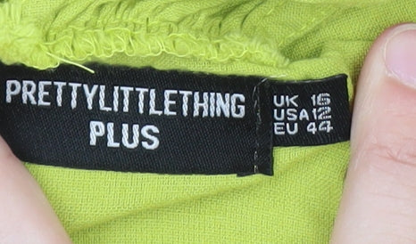 Brand and care label for PRETTYLITTLETHING Plus Green One Shoulder Fringe Mini Dress, size 16