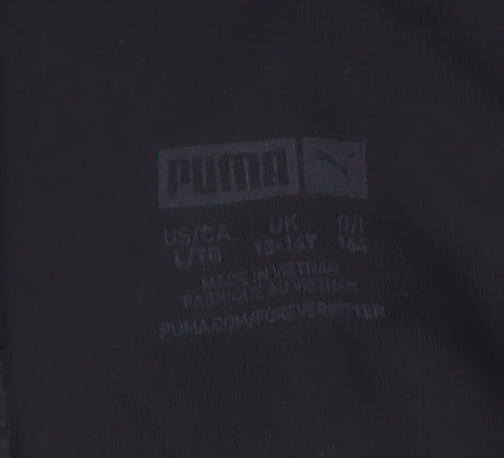 Brand and care label for Puma girls’ black 13-14 years activewear leggings with logo print
