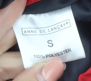 Brand and care label for Anne De Lancay women’s red puffer jacket, size S, full zip winter coat