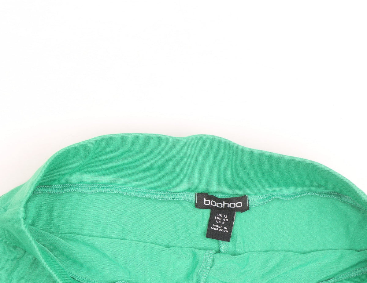 Prewornwholesale green racerback sports bra with medium support and seamless construction for activewear.