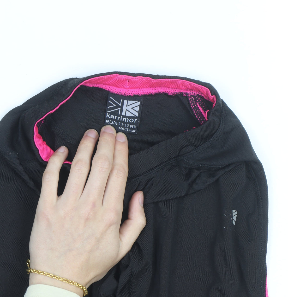 Brand and care label for Karrimor girls’ black pink running track pants 11-12 years activewear trousers