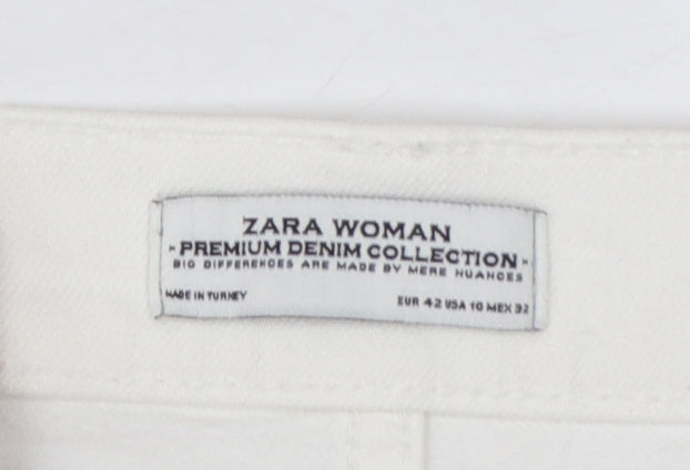Brand and care label for Zara Woman White Distressed Boyfriend Jeans, size 14