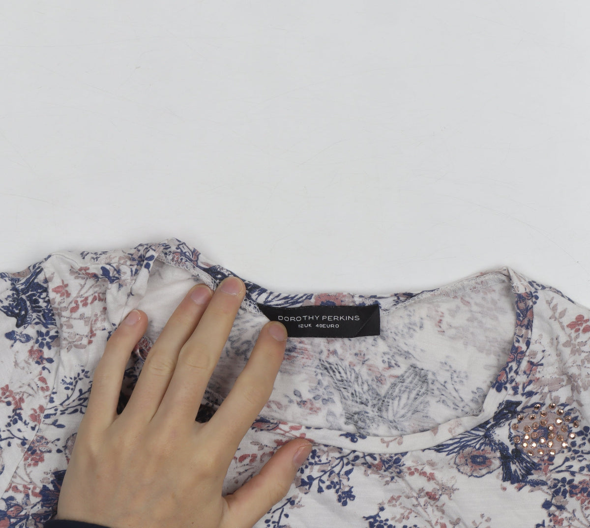 Brand and care label for Dorothy Perkins Women’s Multicoloured Floral Beaded T-Shirt, size UK 12