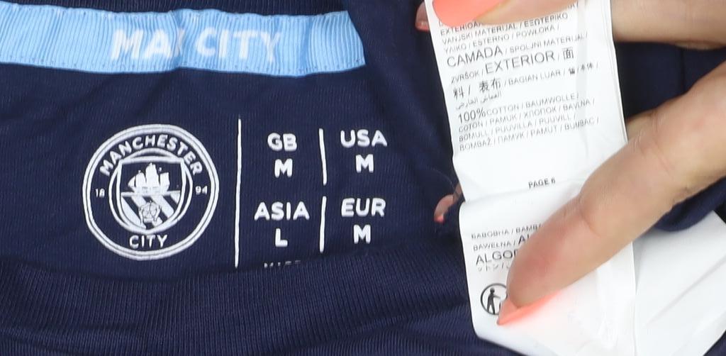 Brand and care label for Manchester City Men’s Blue M Long Sleeve 93 Graphic T-Shirt
