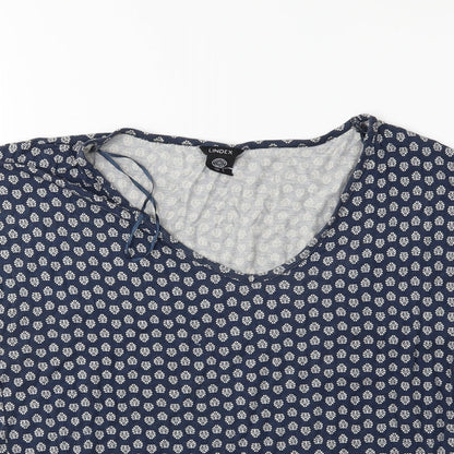 Close-up detail of Preworn women’s beige floral basic t-shirt, size S