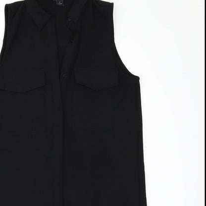 Close-up detail of MONK women’s black tunic blouse, size S
