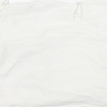 Brand and care label for SHEIN girls’ white basic blouse, size 7-8, years