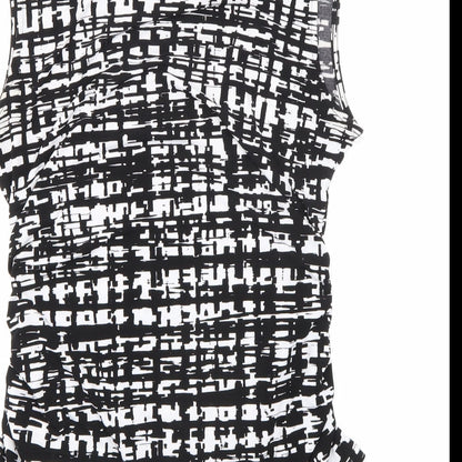 Brand and care label for Tahari women’s black basic tank, size L