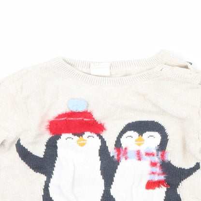 Close-up detail of H&M girls’ beige jumper, size 2, years - penguin