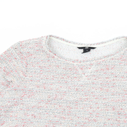 Close-up detail of H&M women’s pink jumper, size M