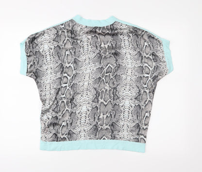 Back view of Dunnes women’s green animal print basic blouse, size M