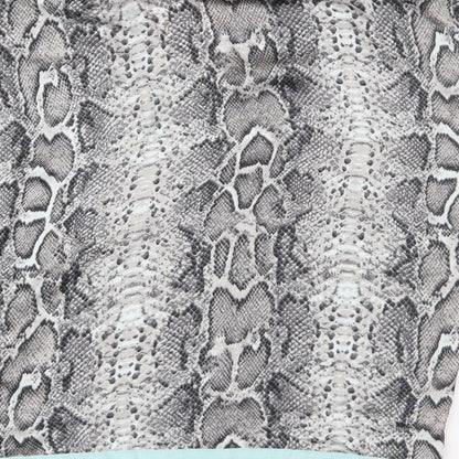 Brand and care label for Dunnes women’s green animal print basic blouse, size M