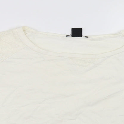 Close-up detail of H&M women’s white jumper, size UK 4