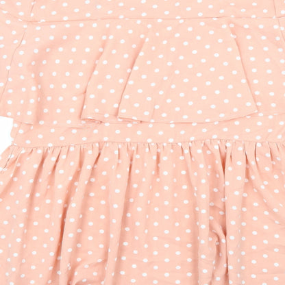 Brand and care label for Lasula women’s pink polka dot rayon a-line, size UK 14