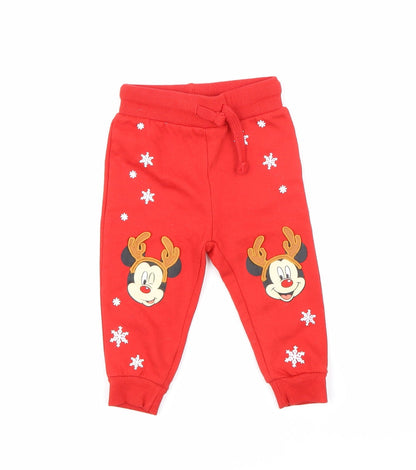 Front view of Disney boys’ red jogger trousers, size 9, months