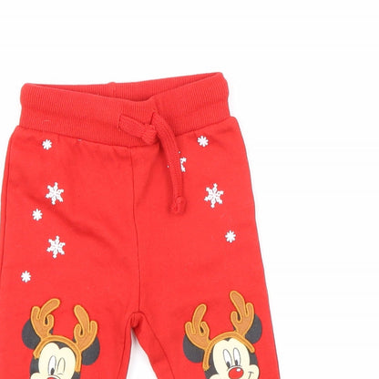 Close-up detail of Disney boys’ red jogger trousers, size 9, months