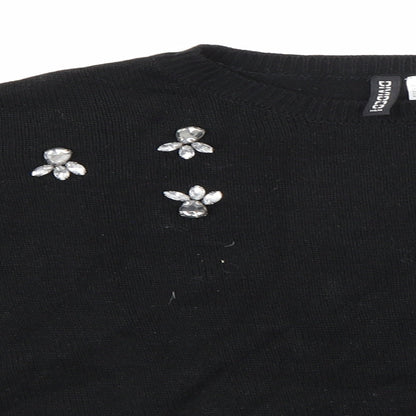 Close-up detail of H&M women’s black knit jumper, size S