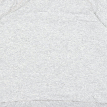 Brand and care label for Decathlon women’s grey jumper, size M