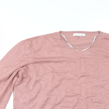 Close-up detail of H&M women’s pink jumper, size M