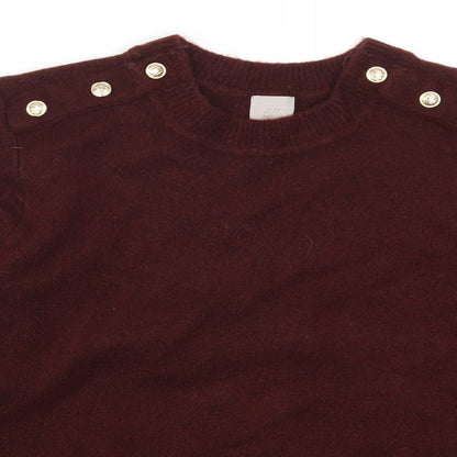 Close-up detail of H&M women’s red jumper, size S