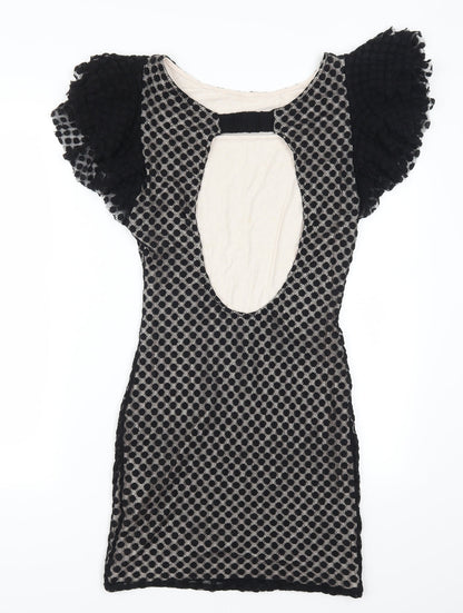Back view of TFNC women’s black polka dot mini, size L, - open back