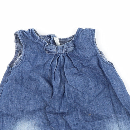 Close-up detail of H&M girls’ blue denim a-line, size 2-3, years