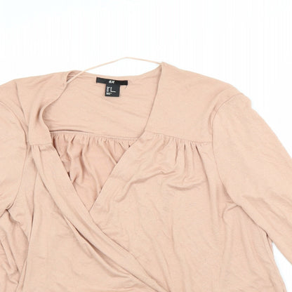 Close-up detail of H&M women’s pink cardigan jumper, size M