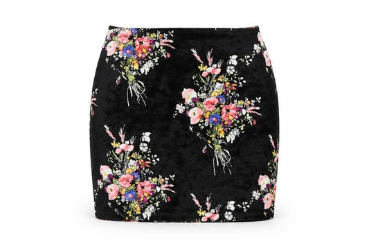 Front view of Preworn women’s black floral mini skirt, size UK 6