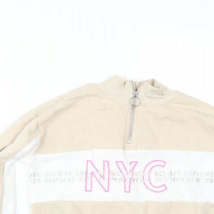 Close-up detail of H&M girls’ beige pullover sweatshirt, size 11-12, years
