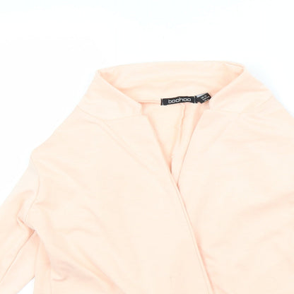 Close-up detail of Boohoo women’s beige cape jumper, size UK 12
