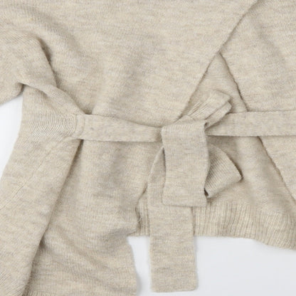 Brand and care label for Tu women’s beige jumper, size UK 10