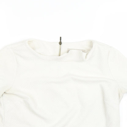 Close-up detail of Marks & Spencer women’s beige basic polo, size UK 10