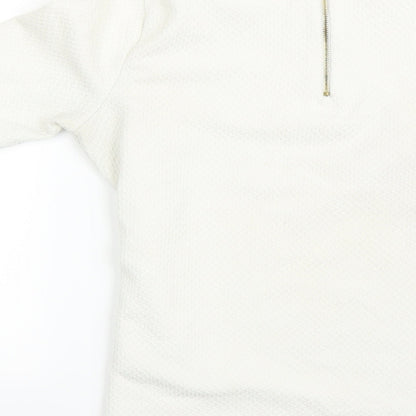 Brand and care label for Marks & Spencer women’s beige basic polo, size UK 10