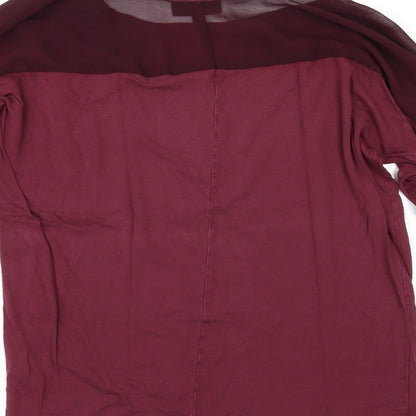 Brand and care label for Warehouse women’s red basic polo, size UK 12