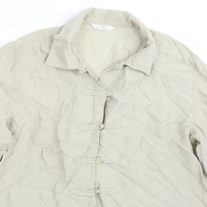 Close-up detail of Marks & Spencer women’s green basic button-up, size UK 16
